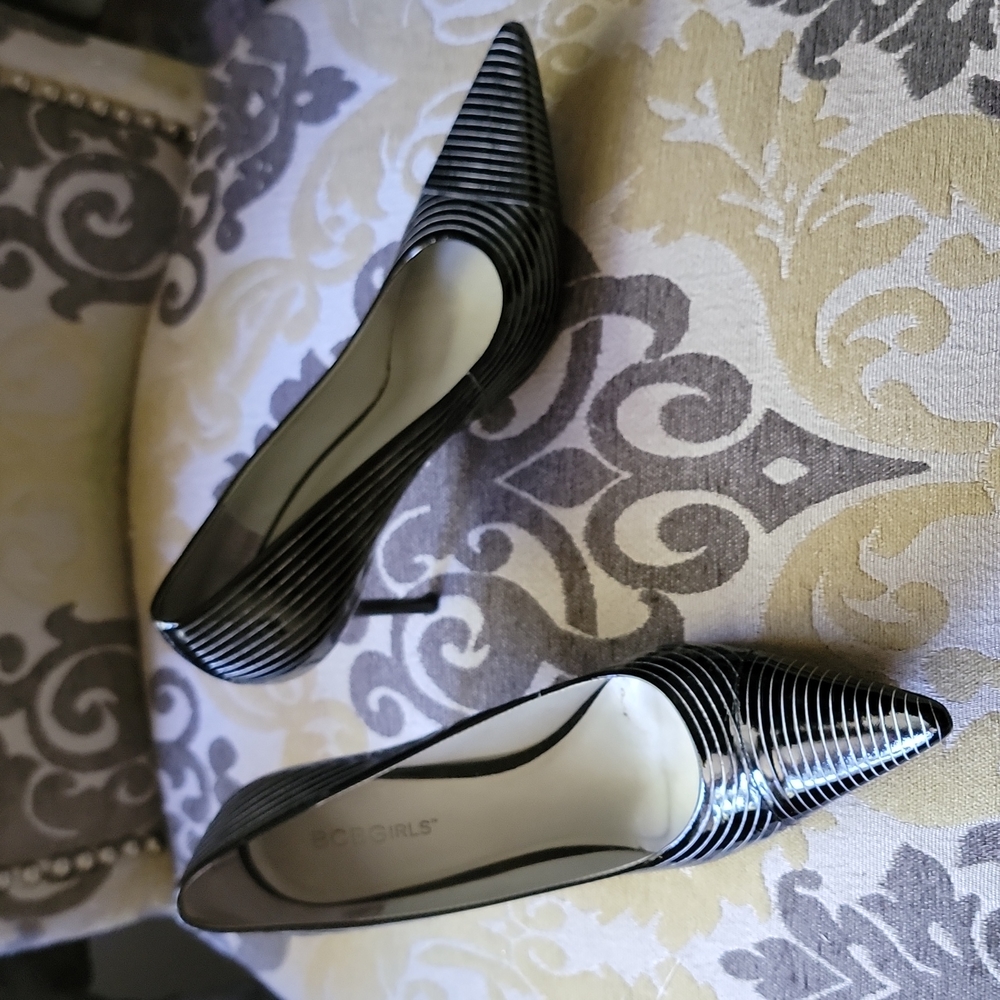 BCBG Classic patent heels with Pin white stripes design .